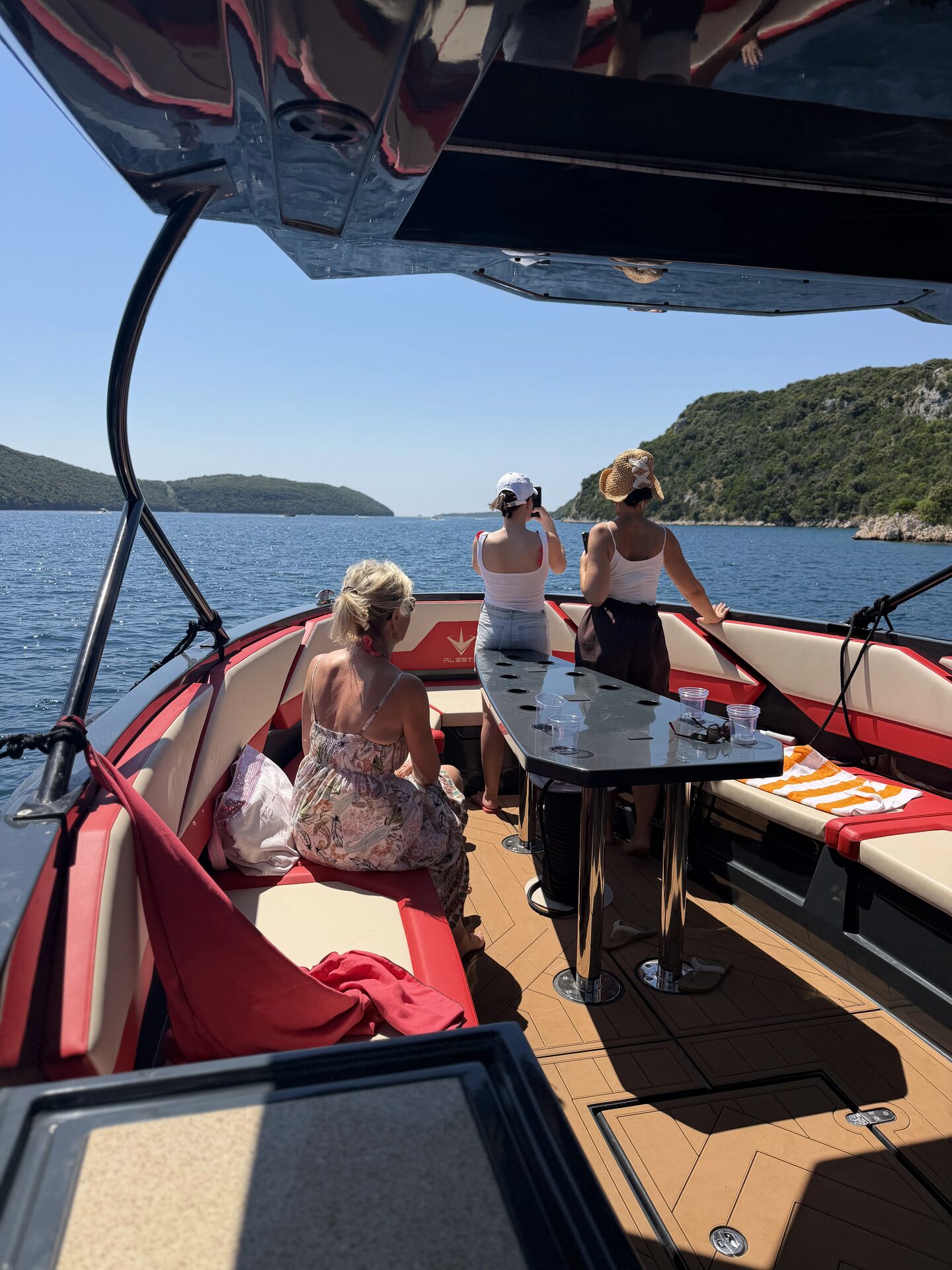 Guests relaxing on the deck of a Mirconi boat off Rovinj